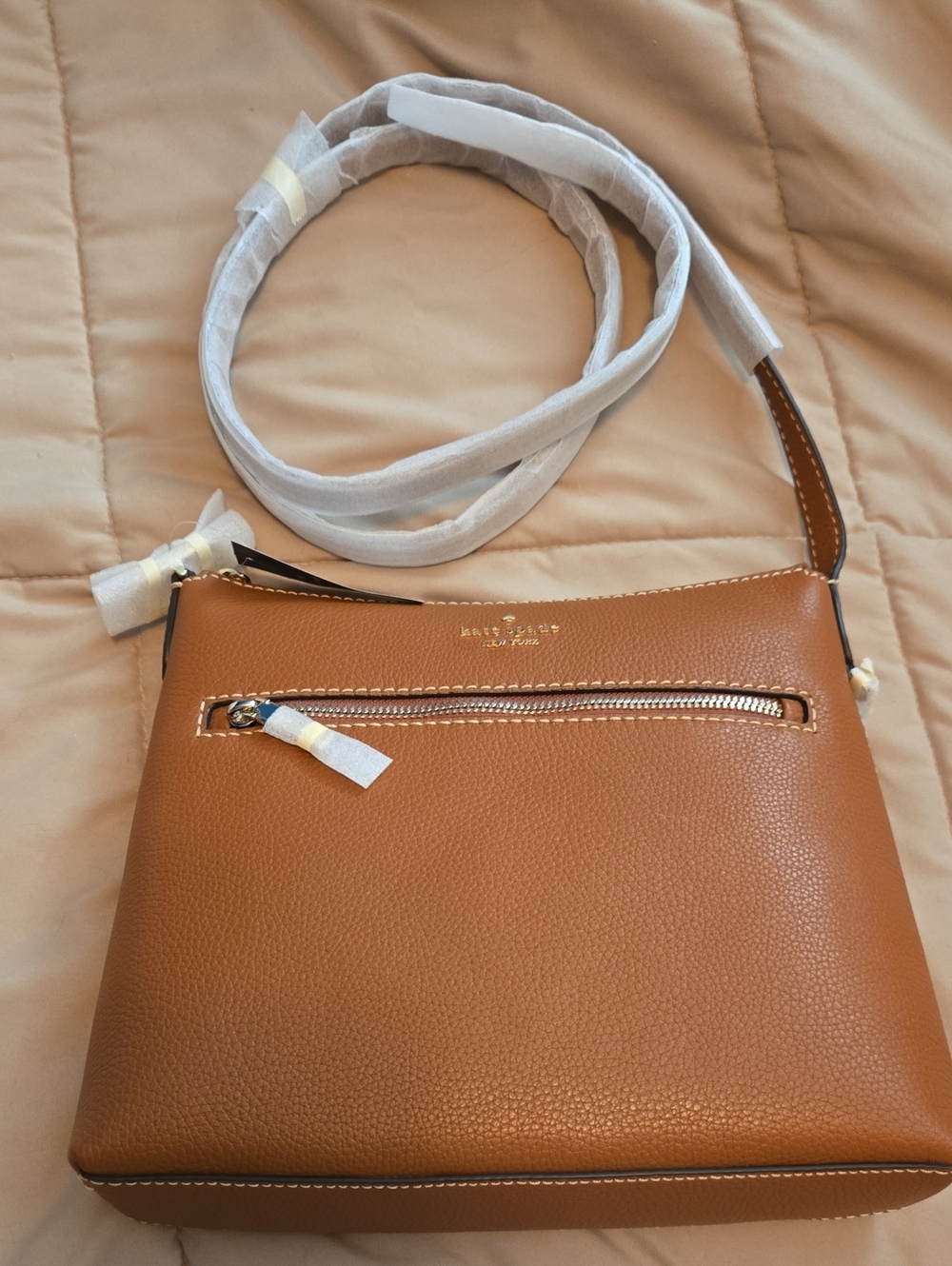 kate spade Pebbled Leather Crossbody Bag in Tan